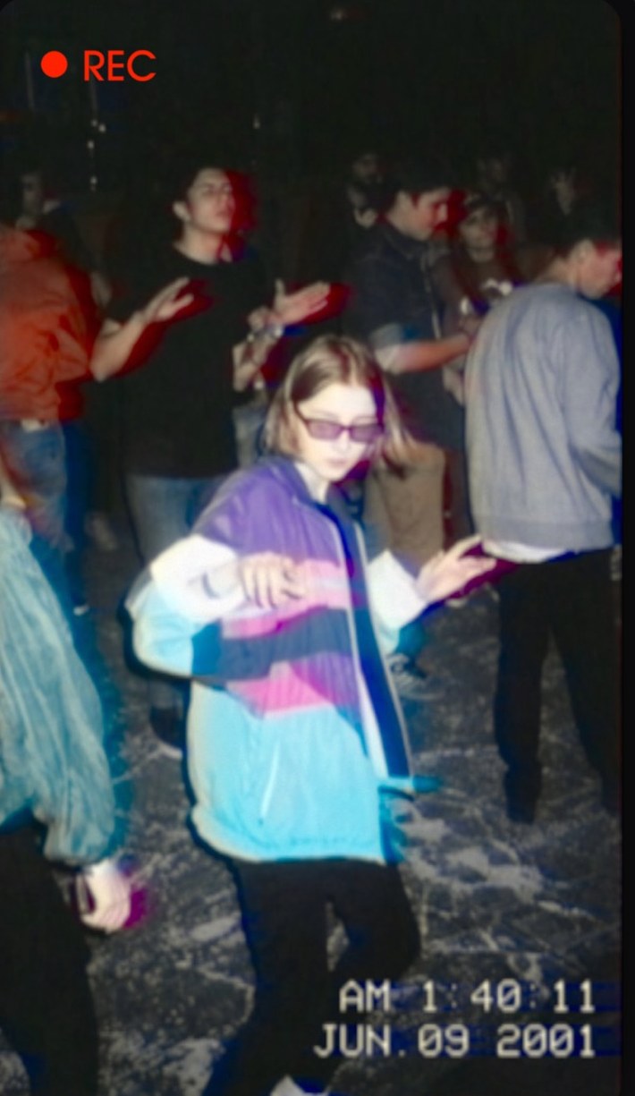 Footage shot with the E240 VHS camera app: a party filmed like a 2001 camcorder tape, with REC indicator and burned-in timestamp